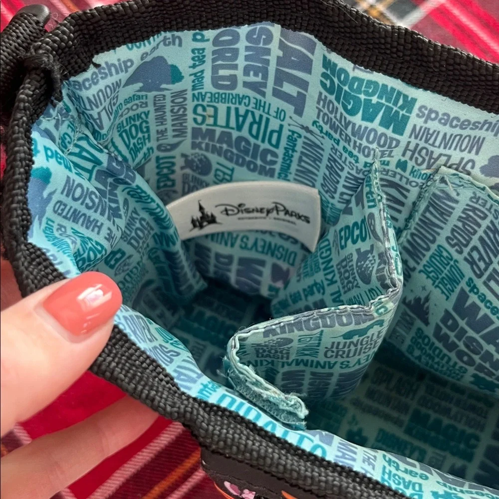 Disney Parks Stroller Organizer featuring an allover character print. GUC